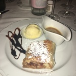 Apple strudel with ice cream and cinnamon icing